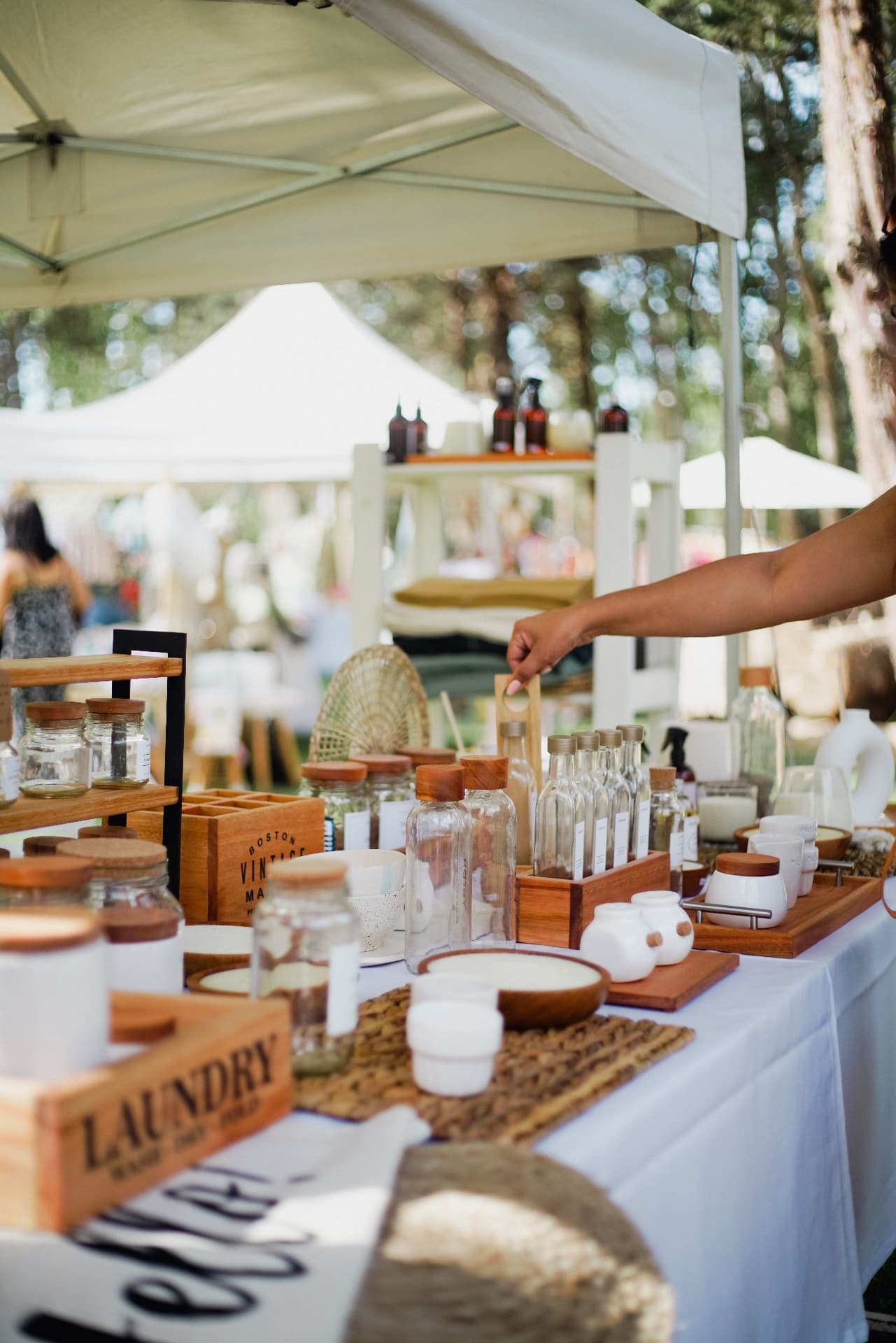 Market stalls filled with handmade goods and shoppers